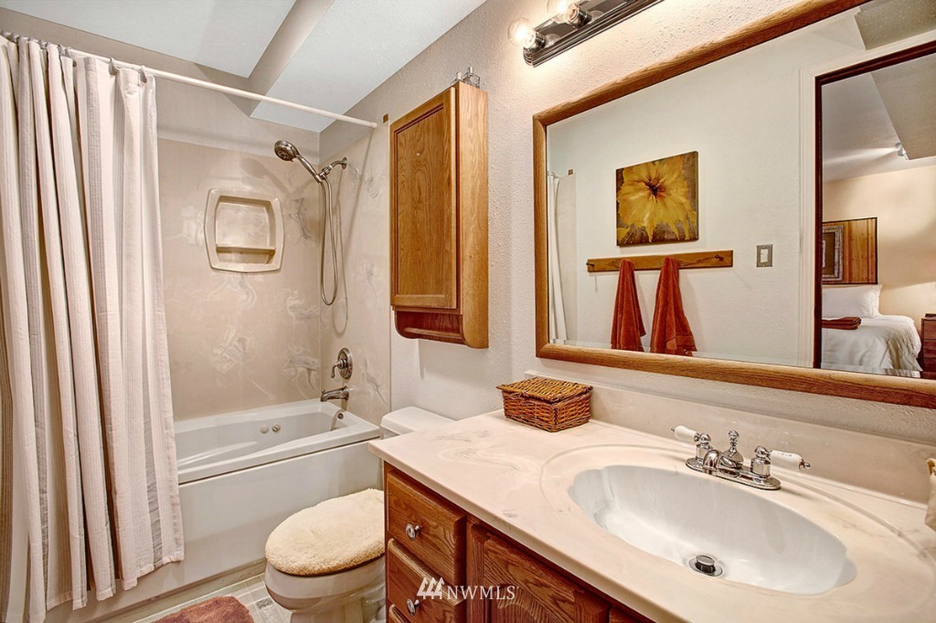 611 204th Street Southeast Bothell, WA 98012 - Photo 14 of 24 a bathroom with a sink toilet and shower