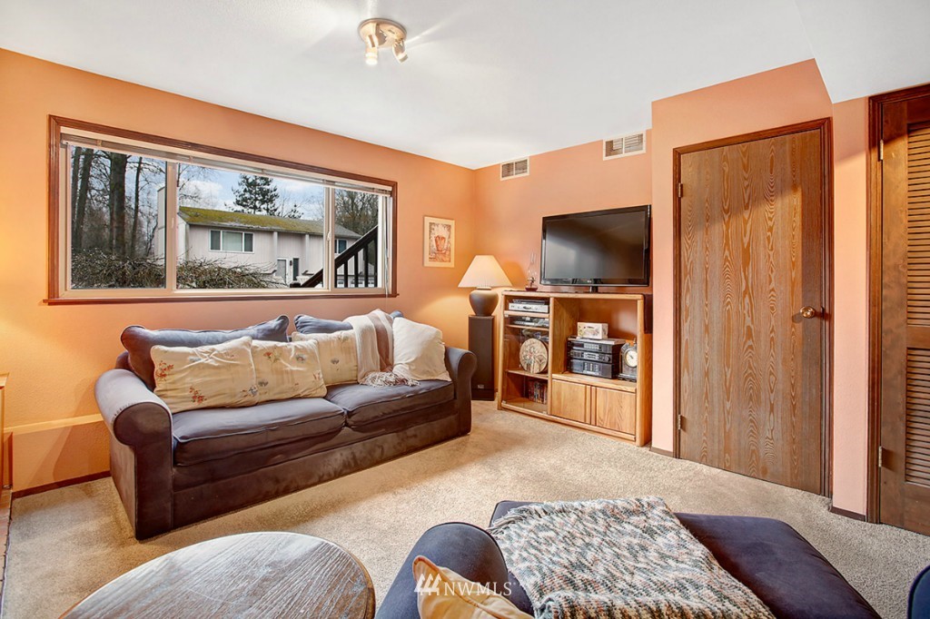 611 204th Street Southeast Bothell, WA 98012 - Photo 16 of 24 a living room with furniture and a flat screen tv