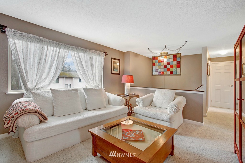 611 204th Street Southeast Bothell, WA 98012 - Photo 3 of 24 a living room with furniture and a large window