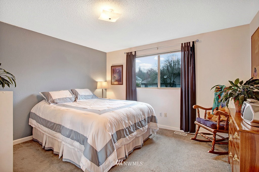 611 204th Street Southeast Bothell, WA 98012 - Photo 10 of 24 a bedroom with a bed and a window