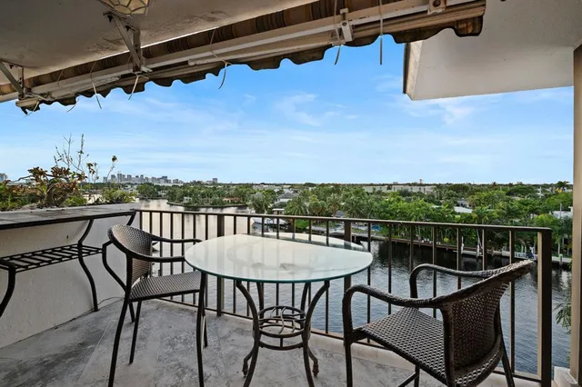 a view of a balcony with chairs
