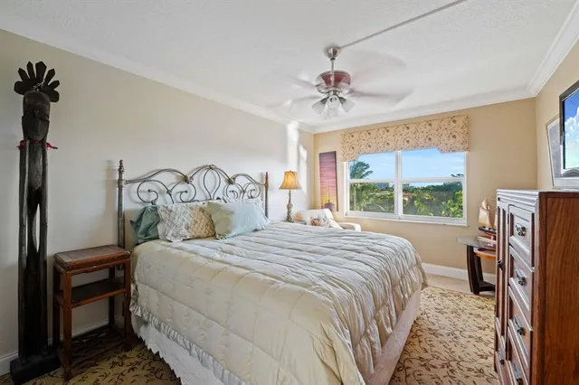 a bedroom with a bed and a flat tv screen