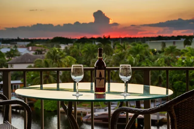 a view of a balcony with a table and chairs