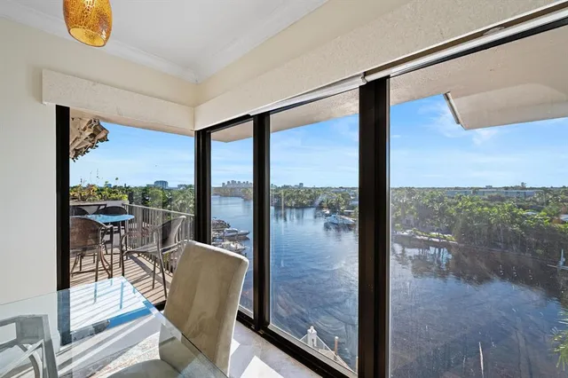 a view of a living room and floor to ceiling window