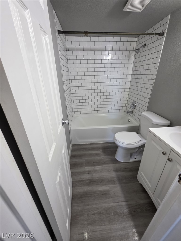 1089 East Desert Inn Road, Unit 3 Las Vegas, NV 89109 - Photo 9 of 15 A well-appointed bathroom features subway tile surrounding the tub and shower.