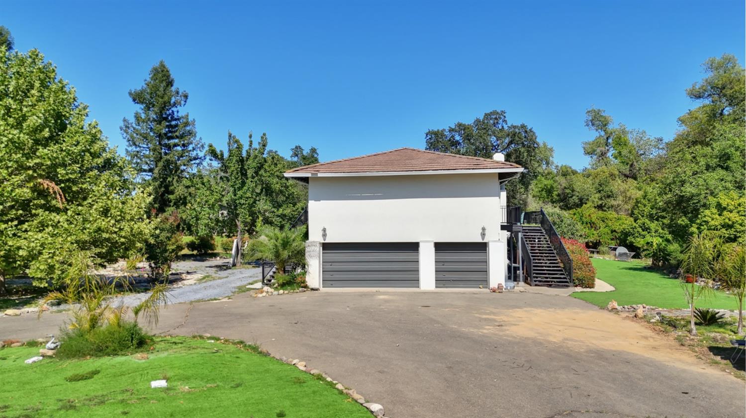 4330 Cavitt Stallman Road Granite Bay, CA 95746 - Photo 85 of 85 a front view of a house with a yard and garage