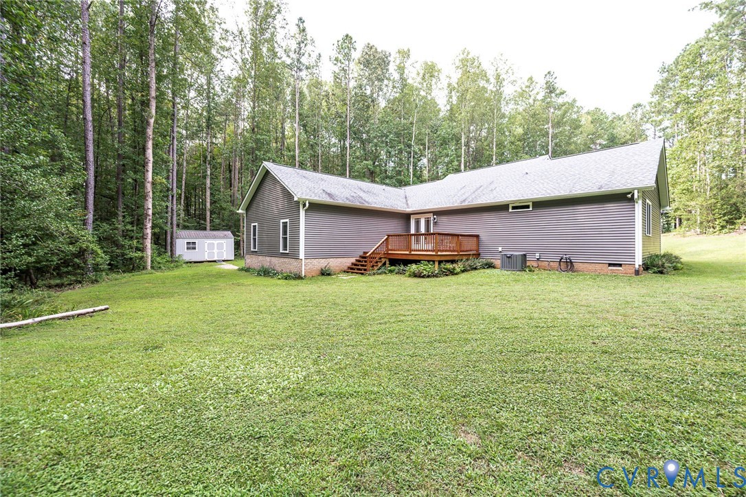 19151 Poor House Road Amelia Court House, VA 23002 - Photo 28 of 39 Expansive grassy area with a wood deck, gray horiz