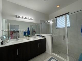 27844 Southwest 133rd Path Homestead, FL 33032 - Photo 11 of 19 a bathroom with a double vanity sink mirror and shower