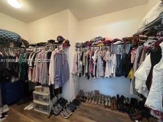 27844 Southwest 133rd Path Homestead, FL 33032 - Photo 12 of 19 a view of walk in closet with clothes and shoes