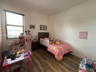 27844 Southwest 133rd Path Homestead, FL 33032 - Photo 13 of 19 a bed room with a bed and a chair