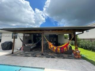 27844 Southwest 133rd Path Homestead, FL 33032 - Photo 16 of 19 a house view with a garden space