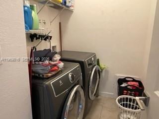 27844 Southwest 133rd Path Homestead, FL 33032 - Photo 18 of 19 a utility room with dryer and washer
