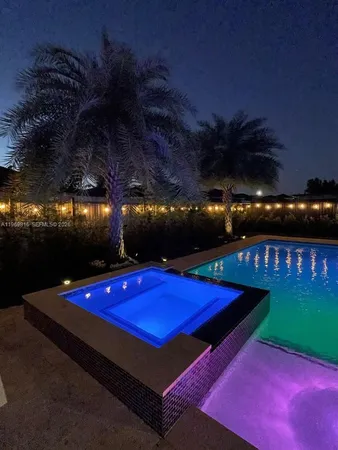 a view of an outdoor space pool patio and outdoor kitchen