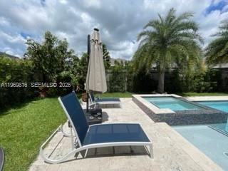 27844 Southwest 133rd Path Homestead, FL 33032 - Photo 5 of 19 a view of a yard with palm trees