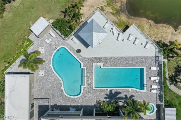 an aerial view of a house with a swimming pool