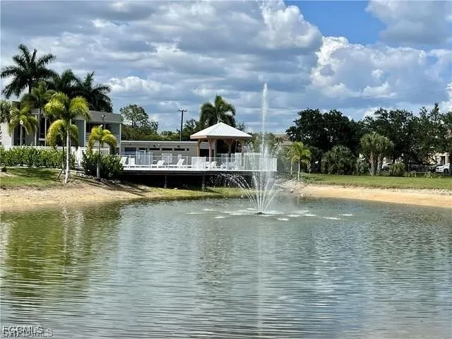 a view of a swimming pool with an outdoor seating