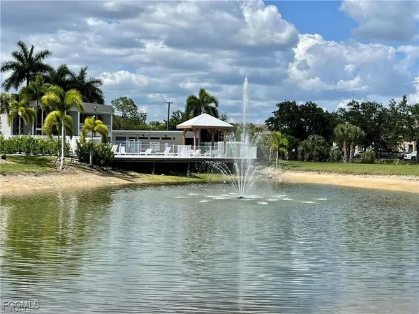 a view of a swimming pool with an outdoor seating