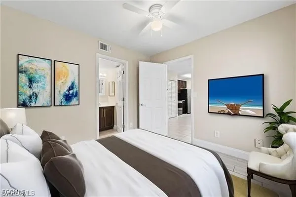 a bedroom with a bed and a couch