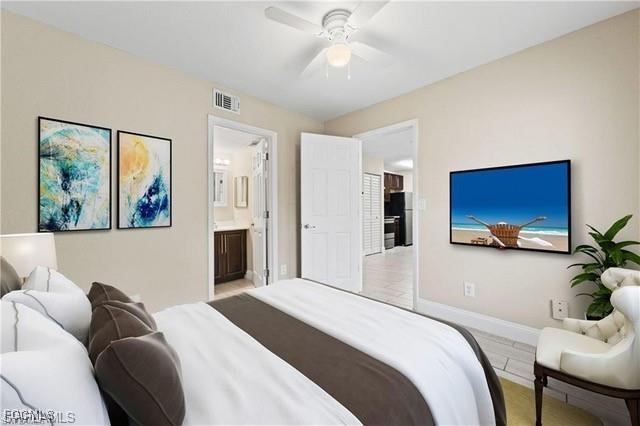 161 Santa Clara Drive, Unit 57S Naples, FL 34104 - Photo 4 of 23 a bedroom with a bed and a couch