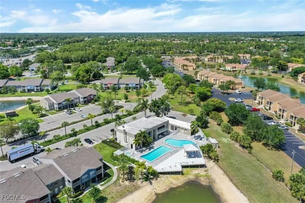an aerial view of residential houses with outdoor space