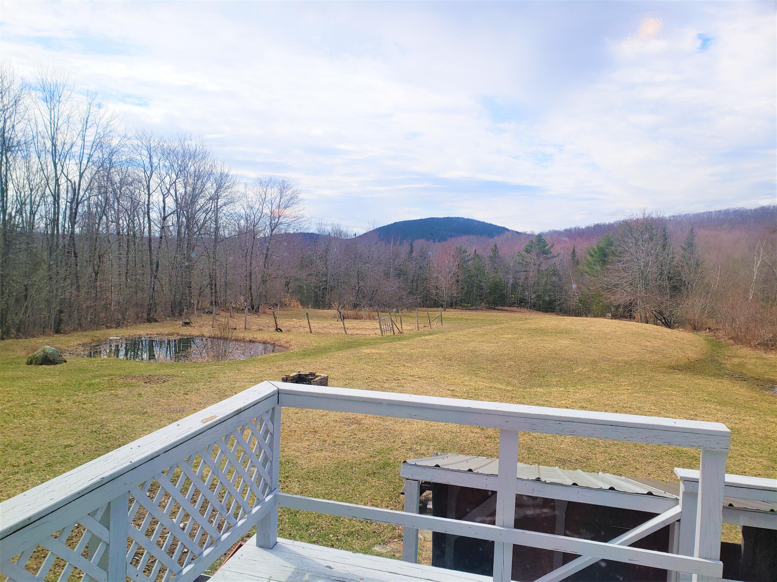39 Winkumpaugh Road Orland, ME 04472 - Photo 18 of 57 First floor BR-Deck door and view to Mou