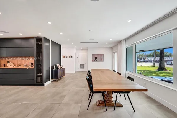 a spacious bathroom with a sink a toilet and a bathtub