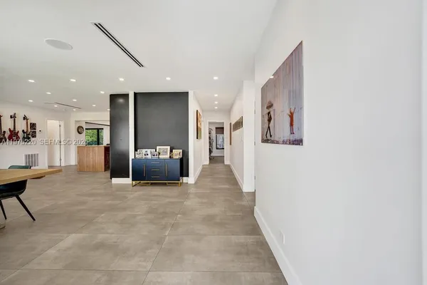 a bedroom with furniture and a baby crib
