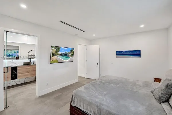 a bed room with a bed and a book shelf