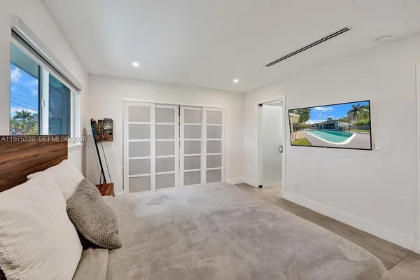 a bathroom with a toilet sink and shower