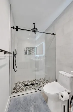 a swimming pool with yard in front of it