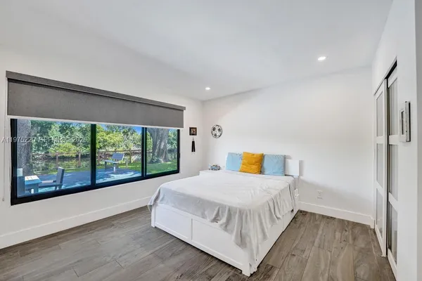 a view of a backyard with sitting area