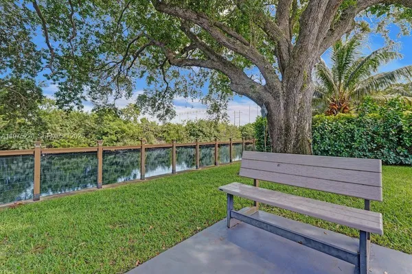 a view of a patio with a table and chairs and couches