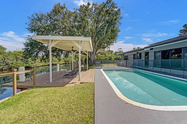a view of a house with a tree in a yard