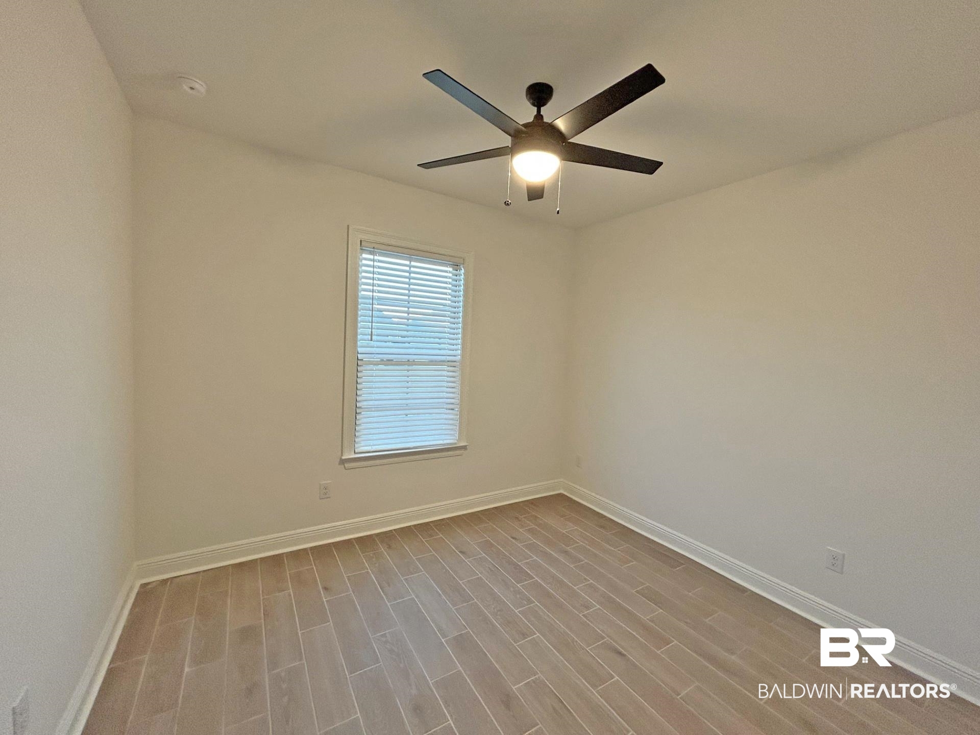 1744 Breckinridge Place Foley, AL 36535 - Photo 18 of 26 Unfurnished room featuring wood tiled floors and a ceiling fan