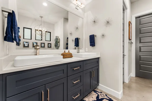 a bathroom with a sink double vanity and a mirror