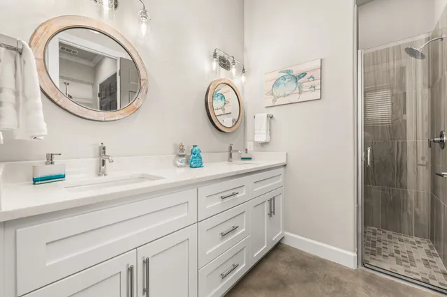 a bathroom with a granite countertop toilet a sink and a mirror