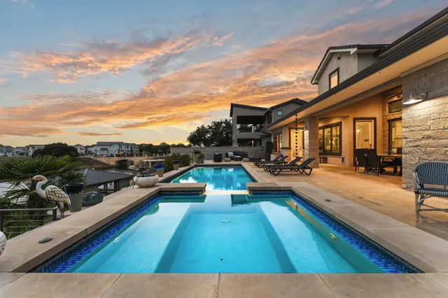 a view of swimming pool with outdoor seating