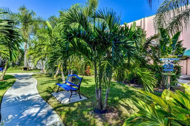 a view of yard with swimming pool and sitting area