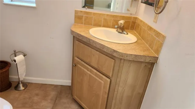 a bathroom with a sink and a mirror