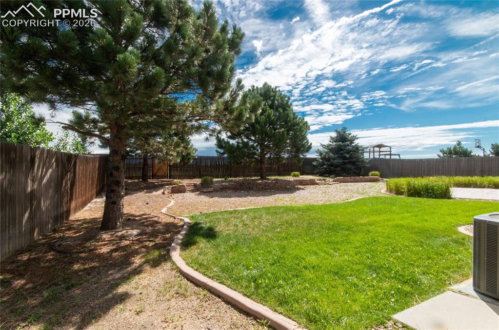 9443 St.George Road Peyton, CO 80831 - Photo 42 of 45 a view of backyard with green space