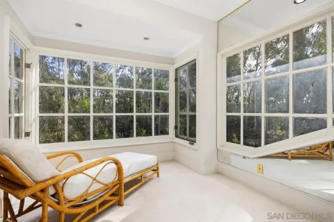 a view of a large window with lounge chair