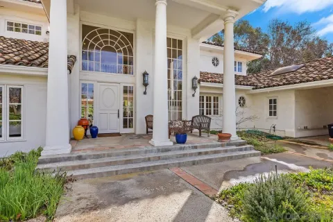a view of a building with car parked
