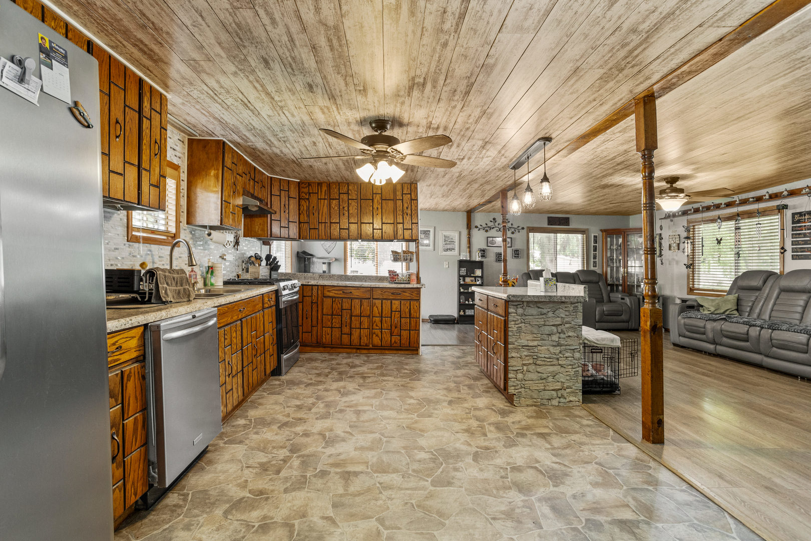 250 Troy Lane Decatur, IL 62526 - Photo 11 of 24 a kitchen with stainless steel appliances kitchen island granite countertop lots of counter top space