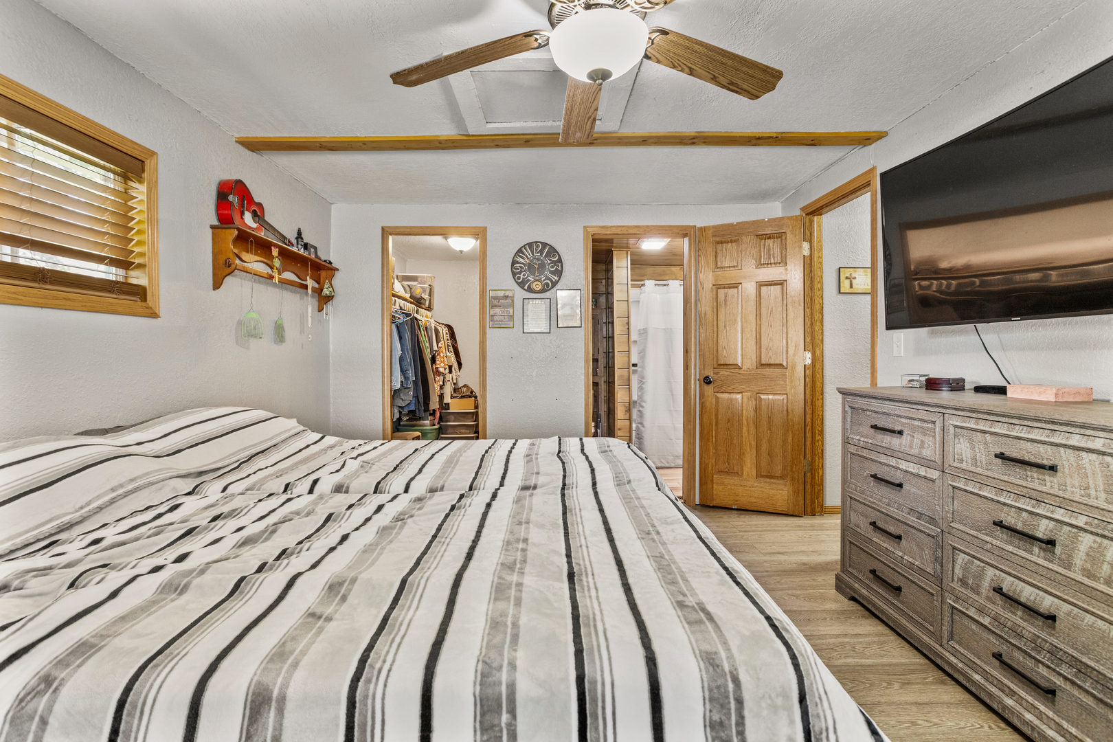 250 Troy Lane Decatur, IL 62526 - Photo 14 of 24 a bedroom with a bed and a flat screen tv