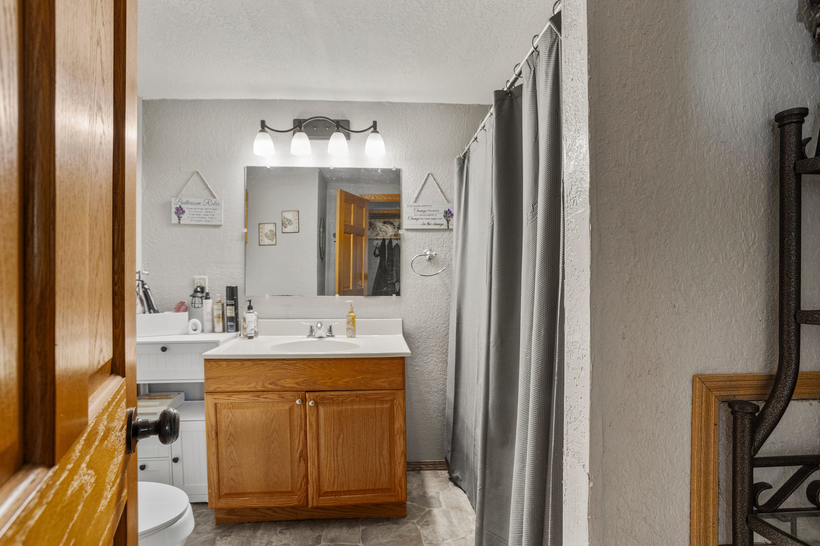 250 Troy Lane Decatur, IL 62526 - Photo 20 of 24 a bathroom with a sink vanity and a mirror