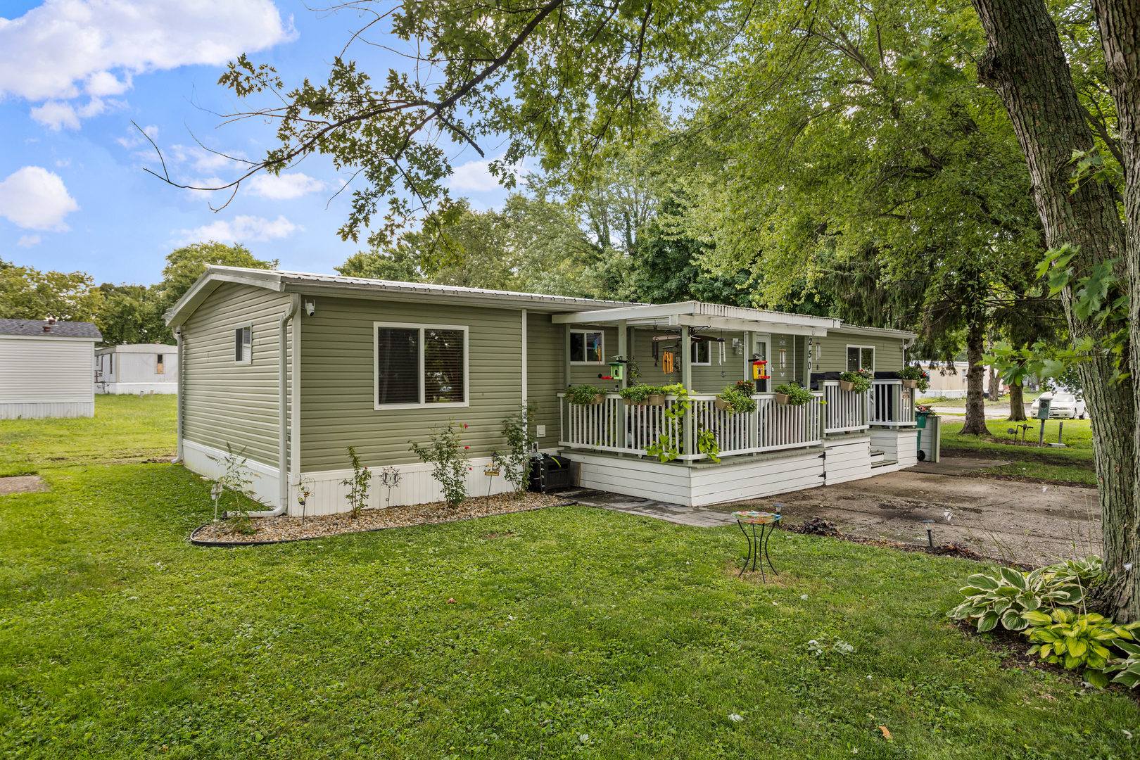 250 Troy Lane Decatur, IL 62526 - Photo 2 of 24 a view of a house with a yard and sitting area