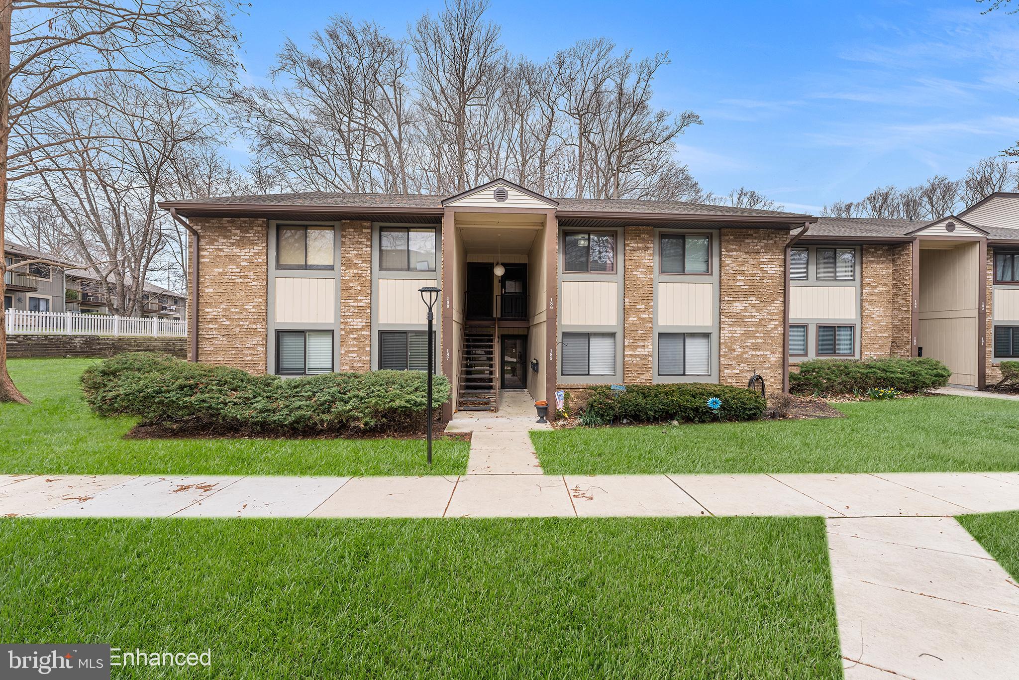 115 East Kings Highway, Unit 186 Maple Shade, NJ 08052 - Photo 2 of 25 a front view of a house with a garden and plants