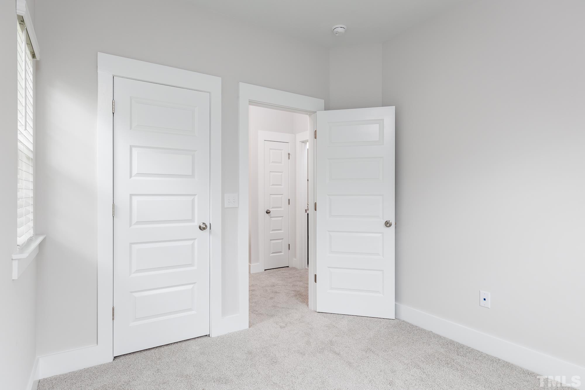 8510 Silsbee Drive Raleigh, NC 27613 - Photo 13 of 18 an empty room with closet area