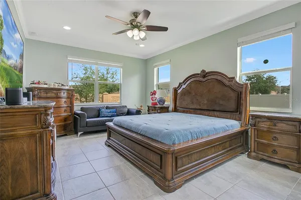 a bedroom with furniture and flat screen tv