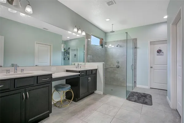 a bathroom with a sink mirror and toilet
